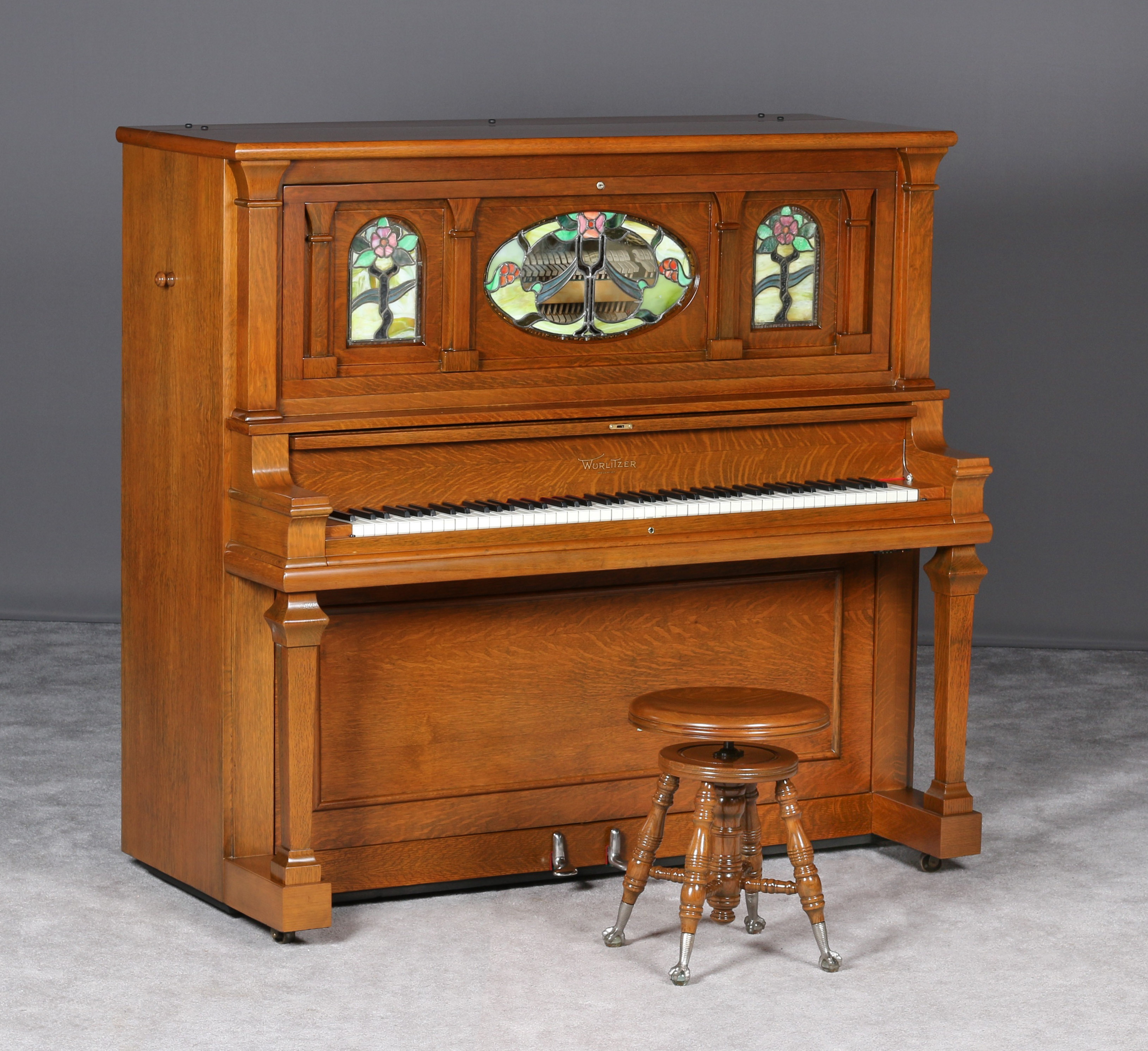 oak player piano with 2 windows on top
