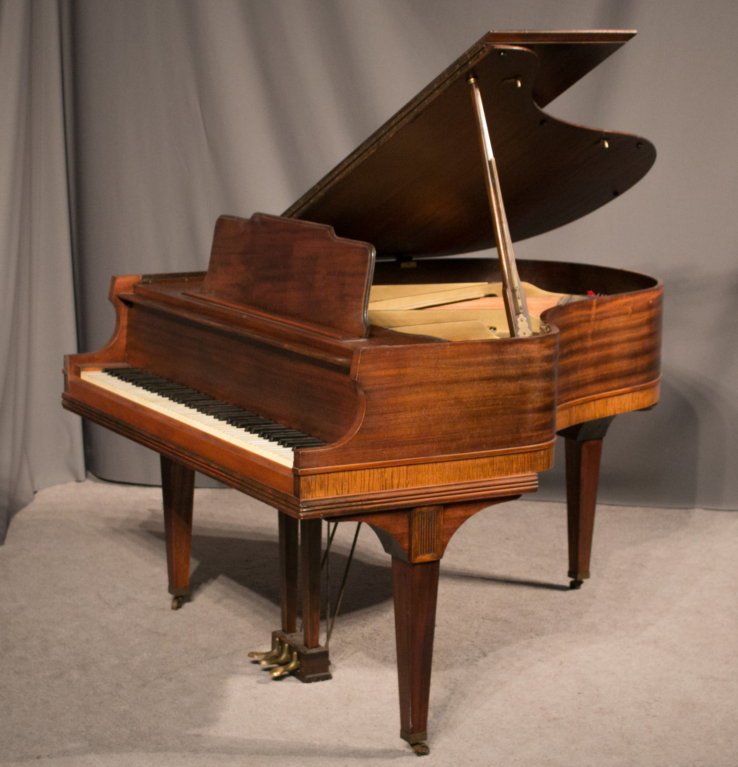 wood baby grand piano